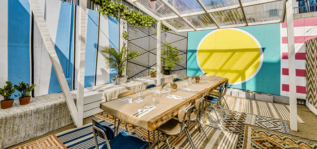 The colorful outdoor patio seating area at Loosie's Kitchen in Brooklyn, NY.