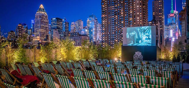 The rooftop deck of Yotel in New York City during their outdoor movie event at night.