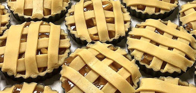 Fresh mini apple pies waiting to be baked at The Smith in NYC.