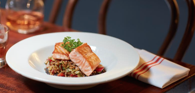 A fresh salmon dish on a white plate at The Smith in New York City.