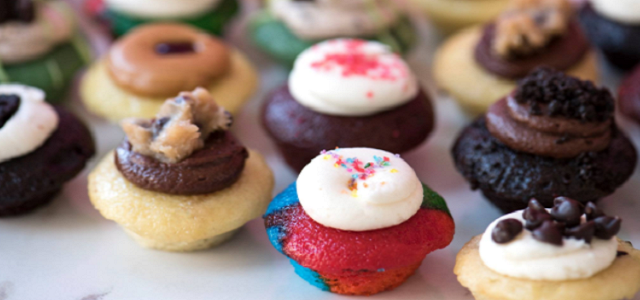 An array of freshly baked colorful miniature cupcakes from Baked by Melissa in NYC.