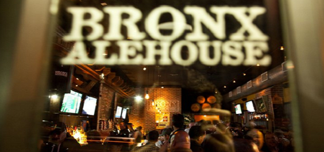 A front view of the Bronx Alehouse at night.