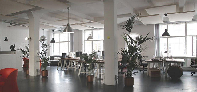 The interior of a grey and white industrial office space.