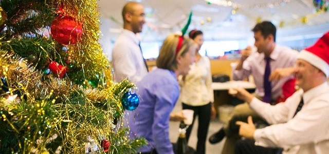 A group of office workers celebrating a holiday party.
