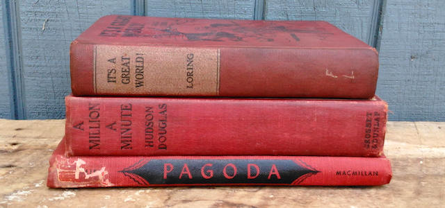 A stack of bright red antique books.