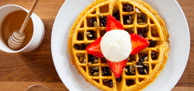 A fresh and fluffy waffle topped with strawberries and whipped cream at Sarabeth's restaurant in NYC.