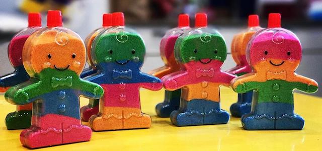 A set of plastic containers shaped like ginger bread men for sand art at The Art Farm in NYC.
