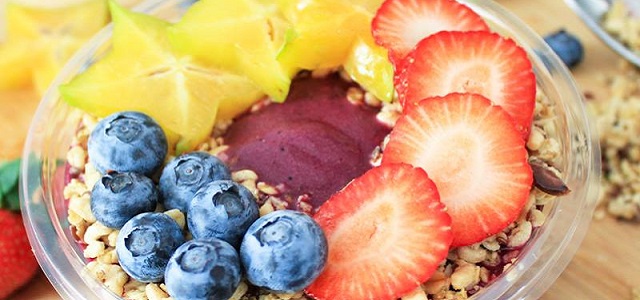 A colorful acai bowl from Juice Generation with fresh fruit.
