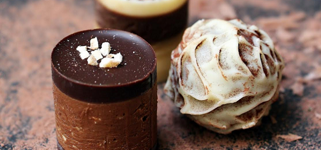 Sweet chocolate treats on a wooden table.