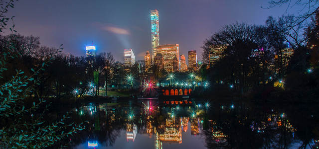 Night-time photography of the New York City skyline taken in central park