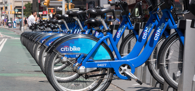 A row of blue Citi Bikes in NYC available for rent.