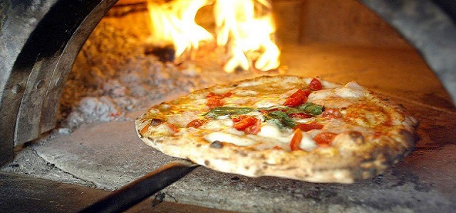 A gluten free pizza in an open fire oven at Pizza Arte in NYC.