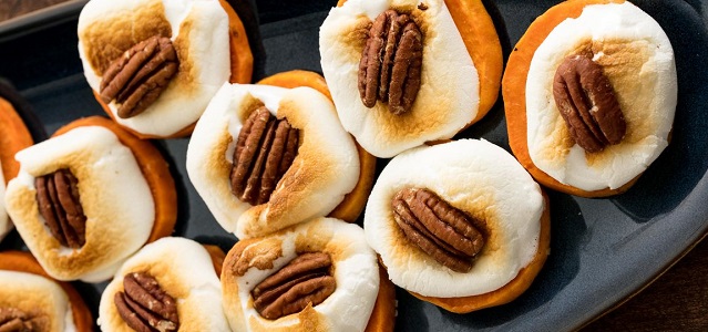 sweet potato slices with a marshmallow and candied pecan