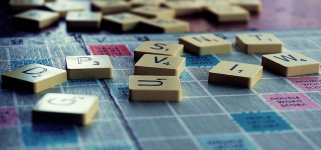 scrabble pieces on game board