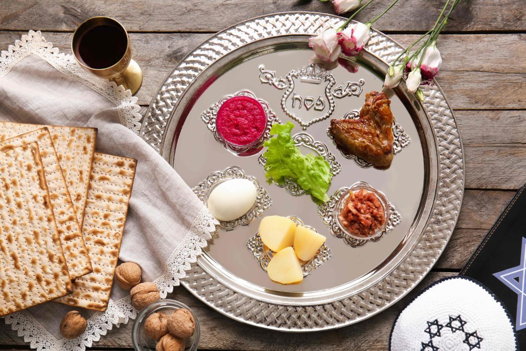 Passover Seder plate with traditional food on table