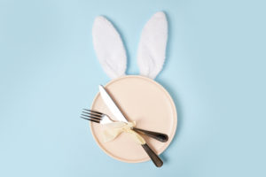 festive Easter table setting with white Easter Bunny ears