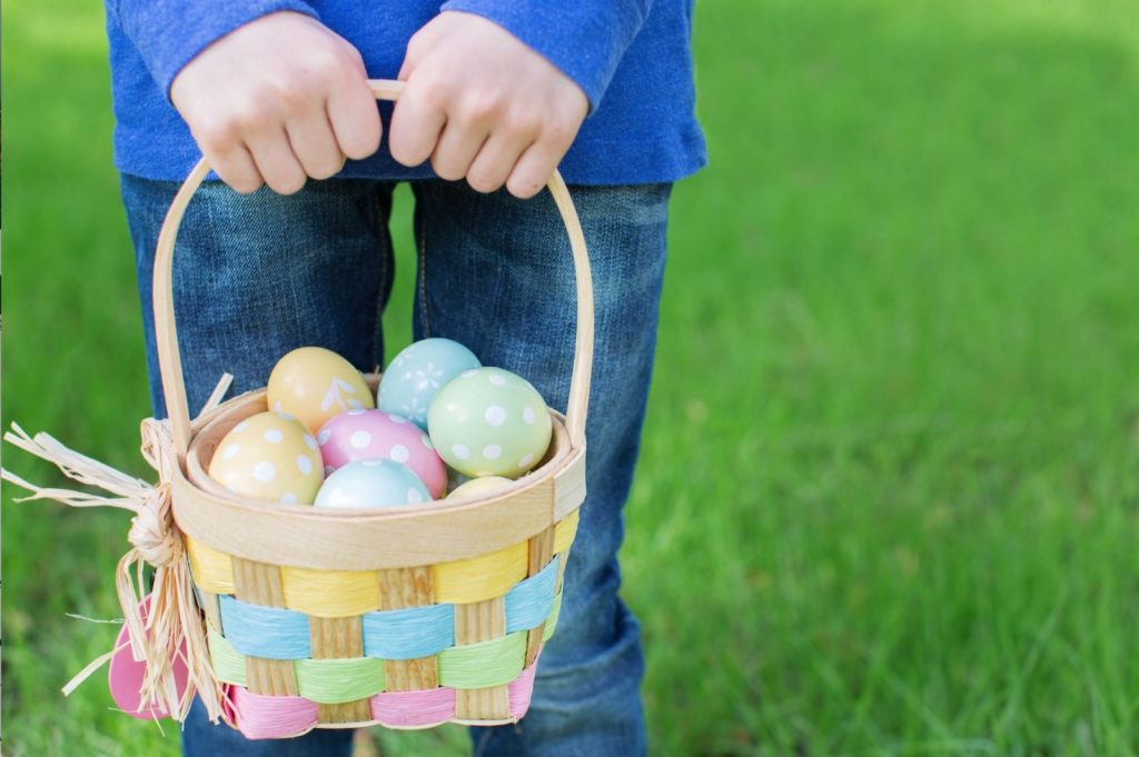 child holding easter basketa