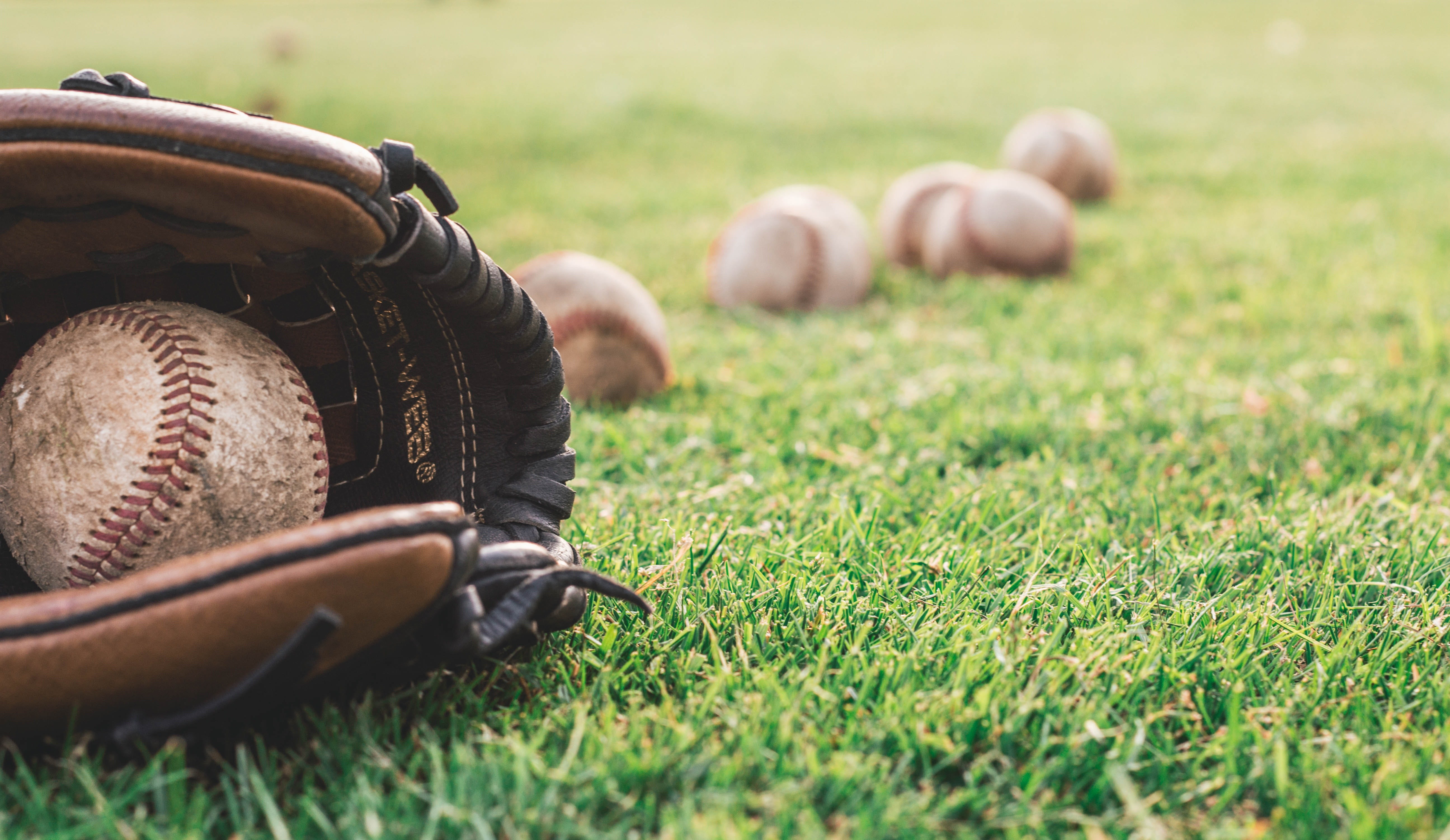 baseball mit with balls