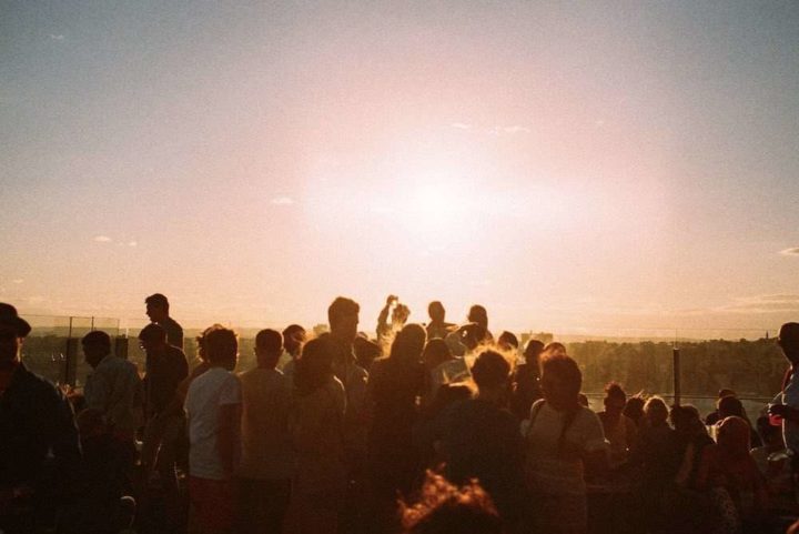 People drinking at sunset