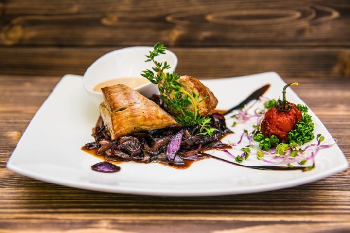 Food on a plate, on a wooden background. Food detail