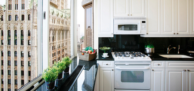 A day time view of New York City from Glenwood's Barclay Tower apartment kitchen.