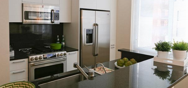 An interior view of Glenwood's Crystal Green apartment building in NYC with an updated kitchen.