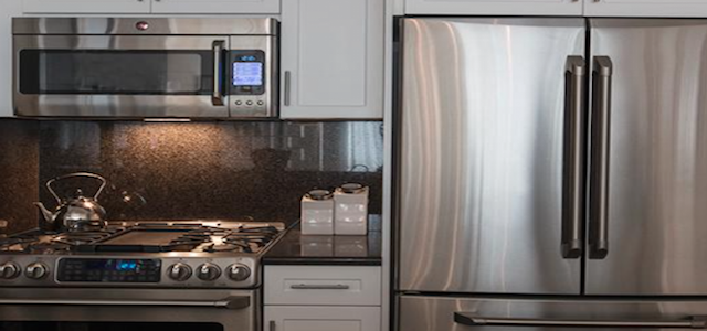A stainless steel kitchen at Glenwood's luxury Emerald Green apartment complex in New York City.