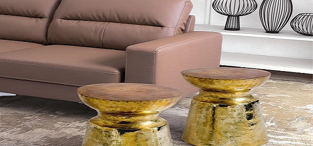 Two golden round tables in a living room.
