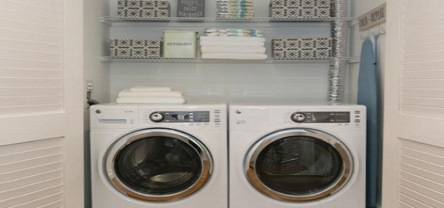 A washing machine and dryer combo inside Glenwood's luxury apartment building, The Sage, in New York City.
