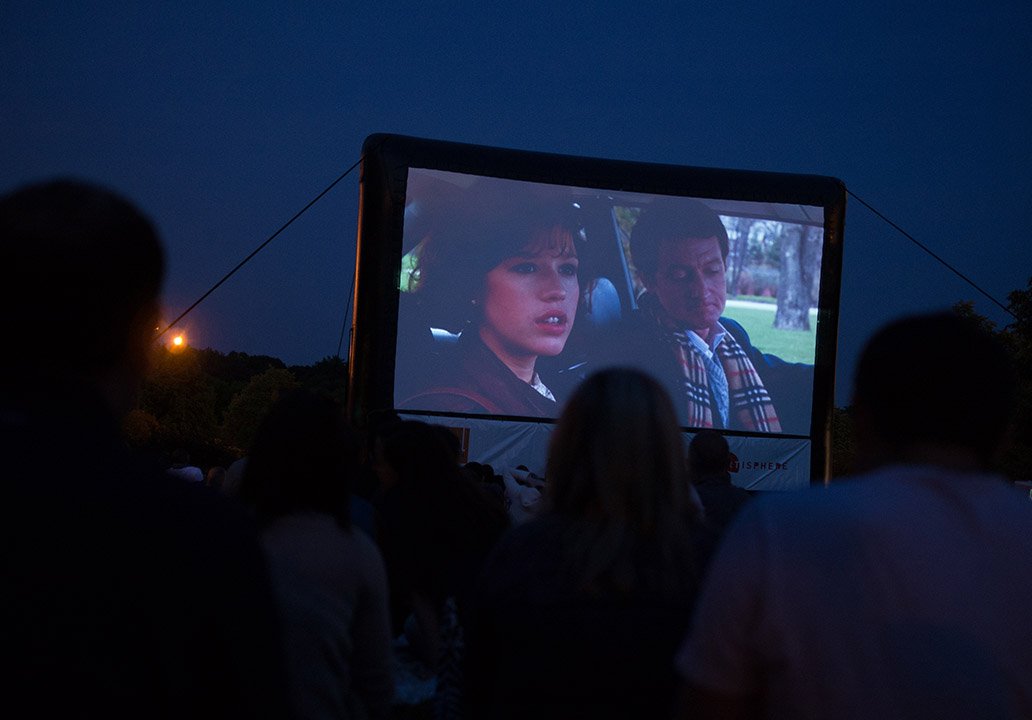 Movie playing on large outdoor movie screen
