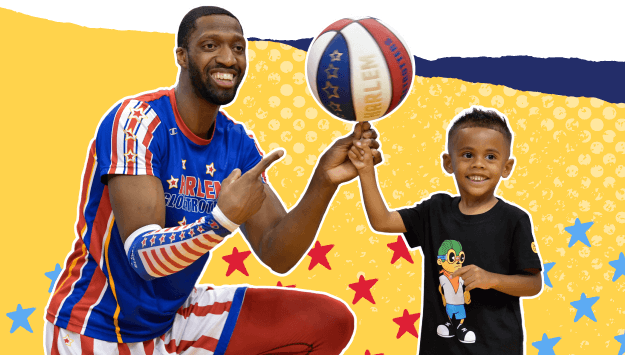 A child spinning the basketball with a Harlem Globetrotter 