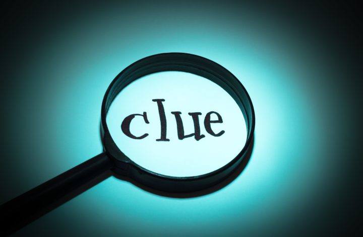 The word clue in a magnifying glass