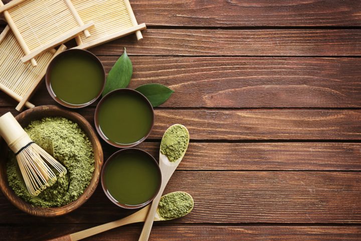 Ingredients for green tea on a wooden table