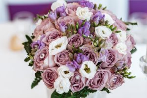A purple pink and white flower arrangement