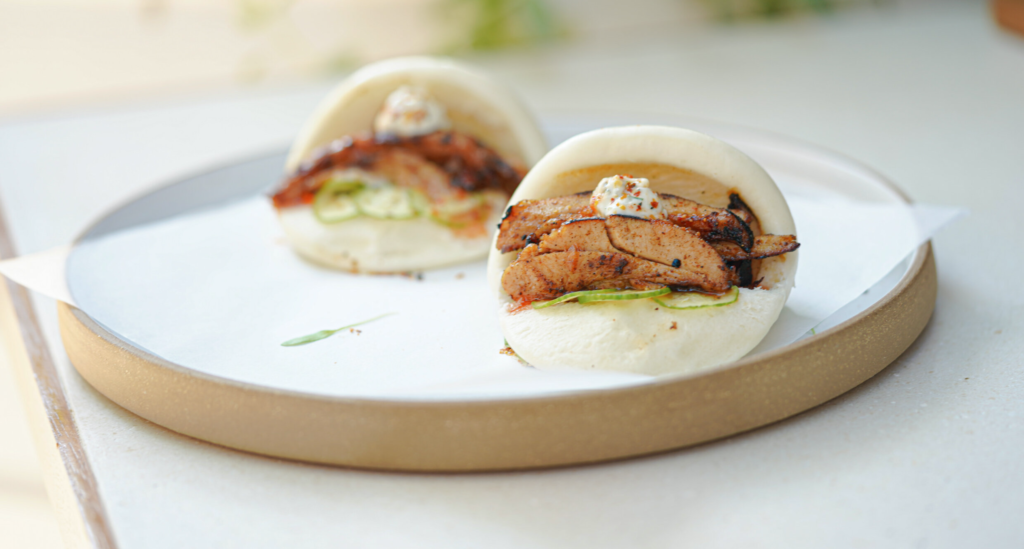 Greek gyro duck buns on white table