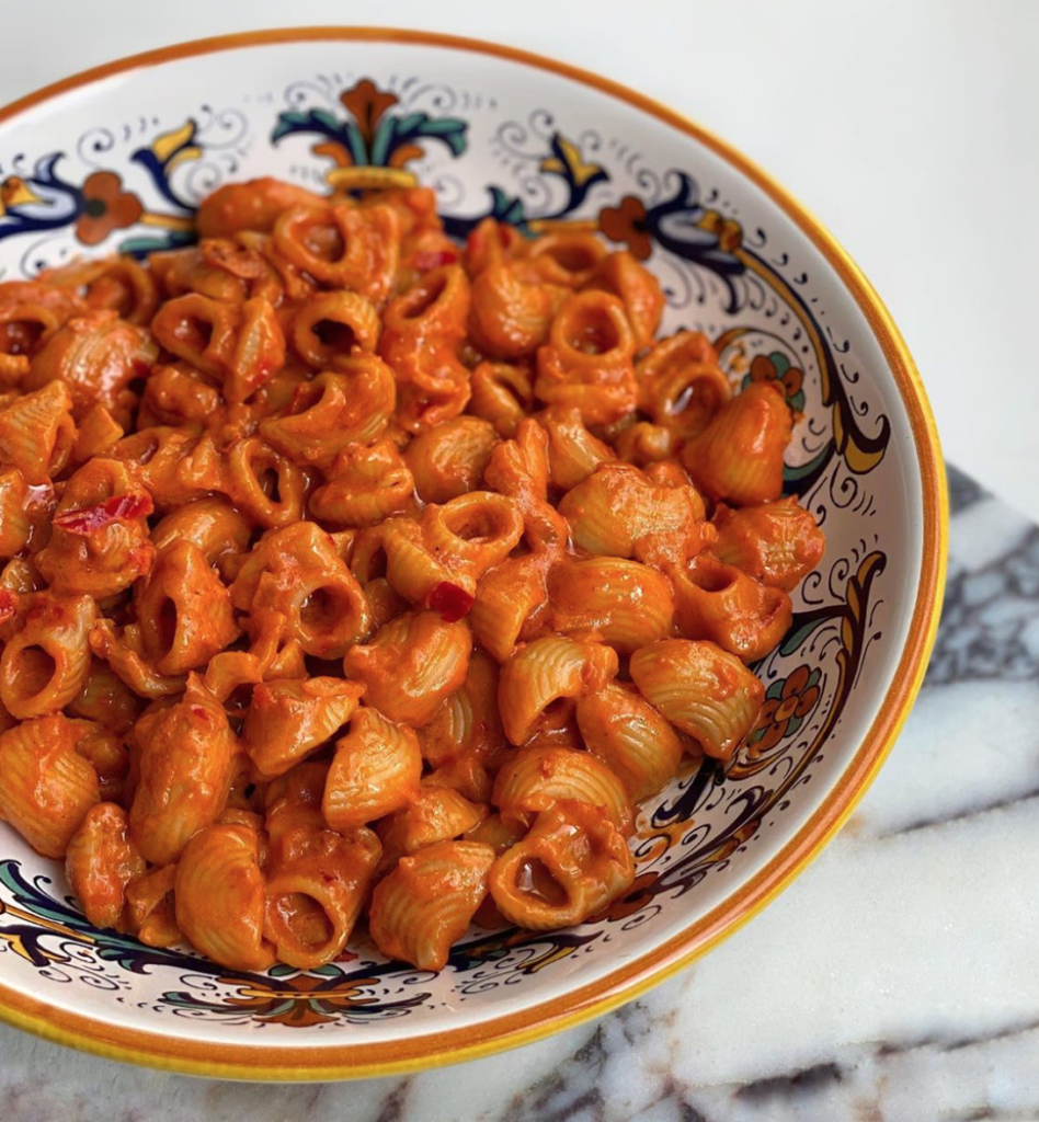 A bowl of spicy rigatoni pasta close up.