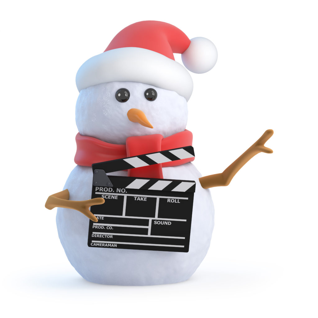 A snow man with a Santa hat holding a movie clap board
