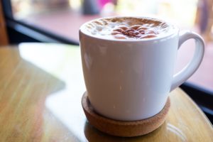 cup of hot coco on a wooden table