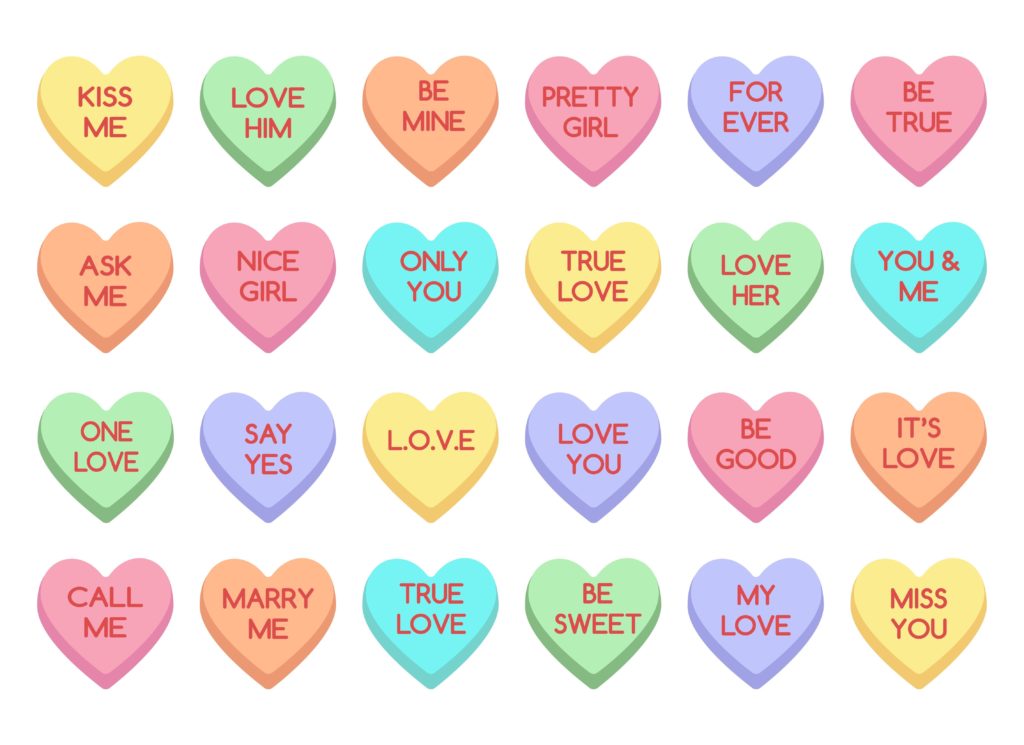 Sweet heart candy on white background with sweet valentines phrases on them