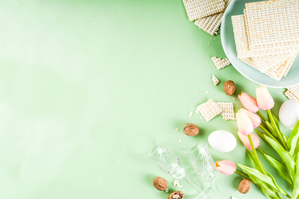 Matzoh and tulips on a green background