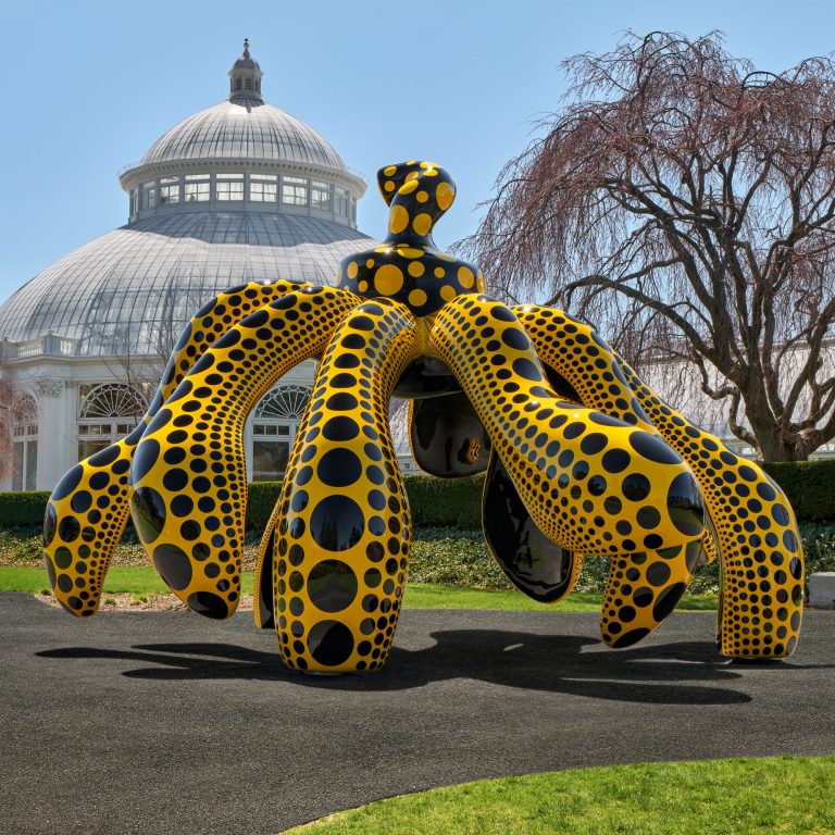 Pumpkin sculpture by artist Kusama at New York Botanical Gardens outside of pagoda 