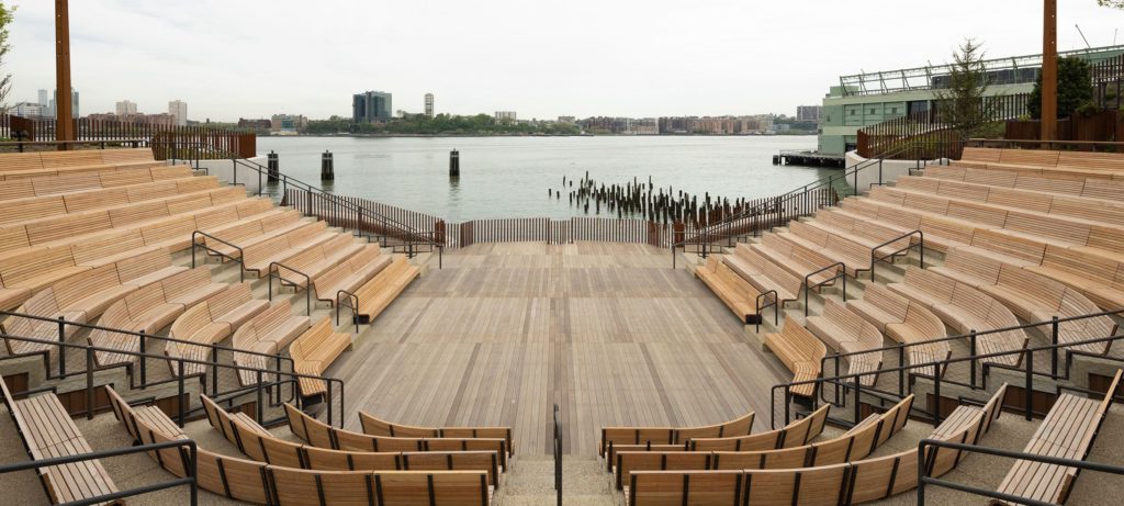 view of little island amphitheater with water views in the background