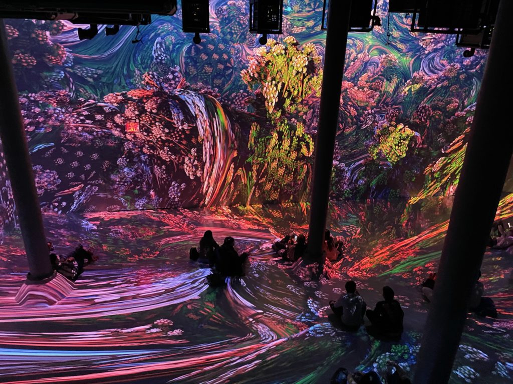 People spectating the 360 degree Van Gogh experience with his paintings projected on walls