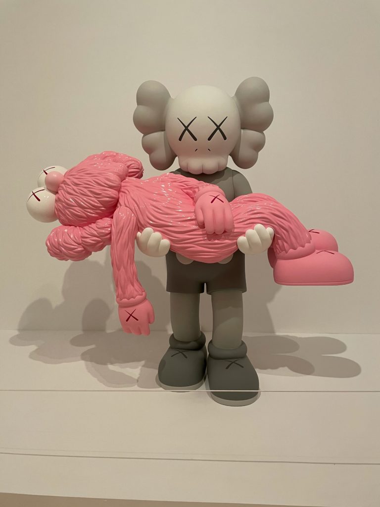 Large KAWS sculpture grey figure holding pink figure