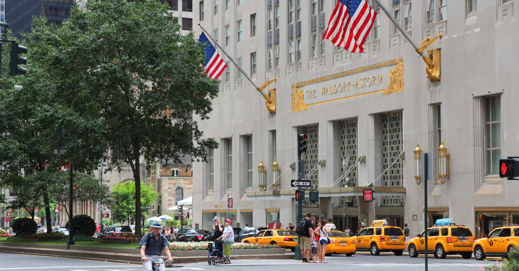 Waldorf Astoria with a line of taxis outside of the the building - Glenwood NYC
