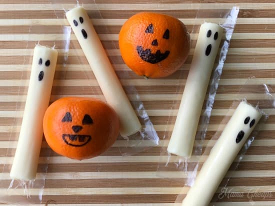 string cheese and tangerine with Ghose face and jack-o-lantern face