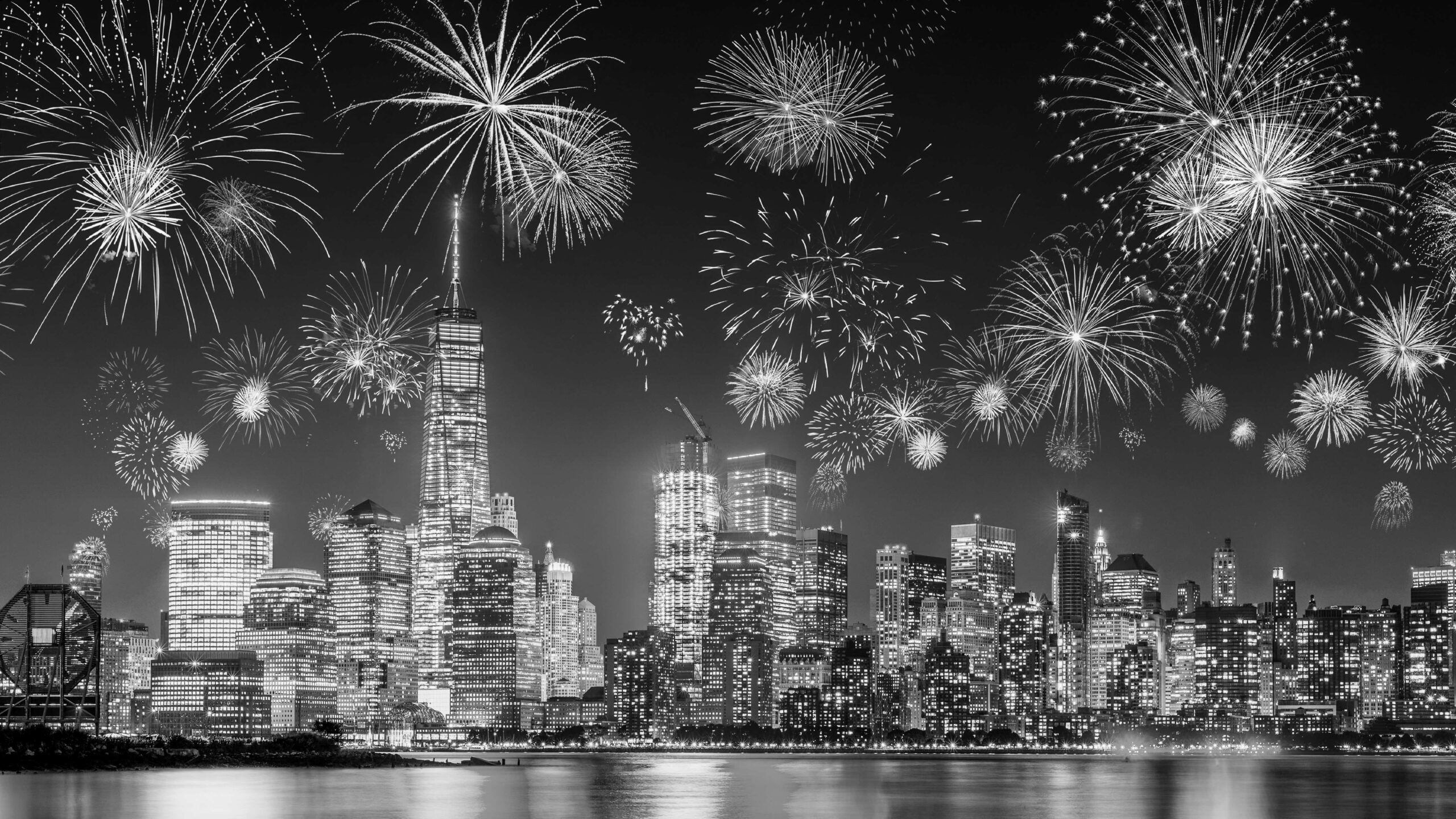 Black and white city skyline with fireworks