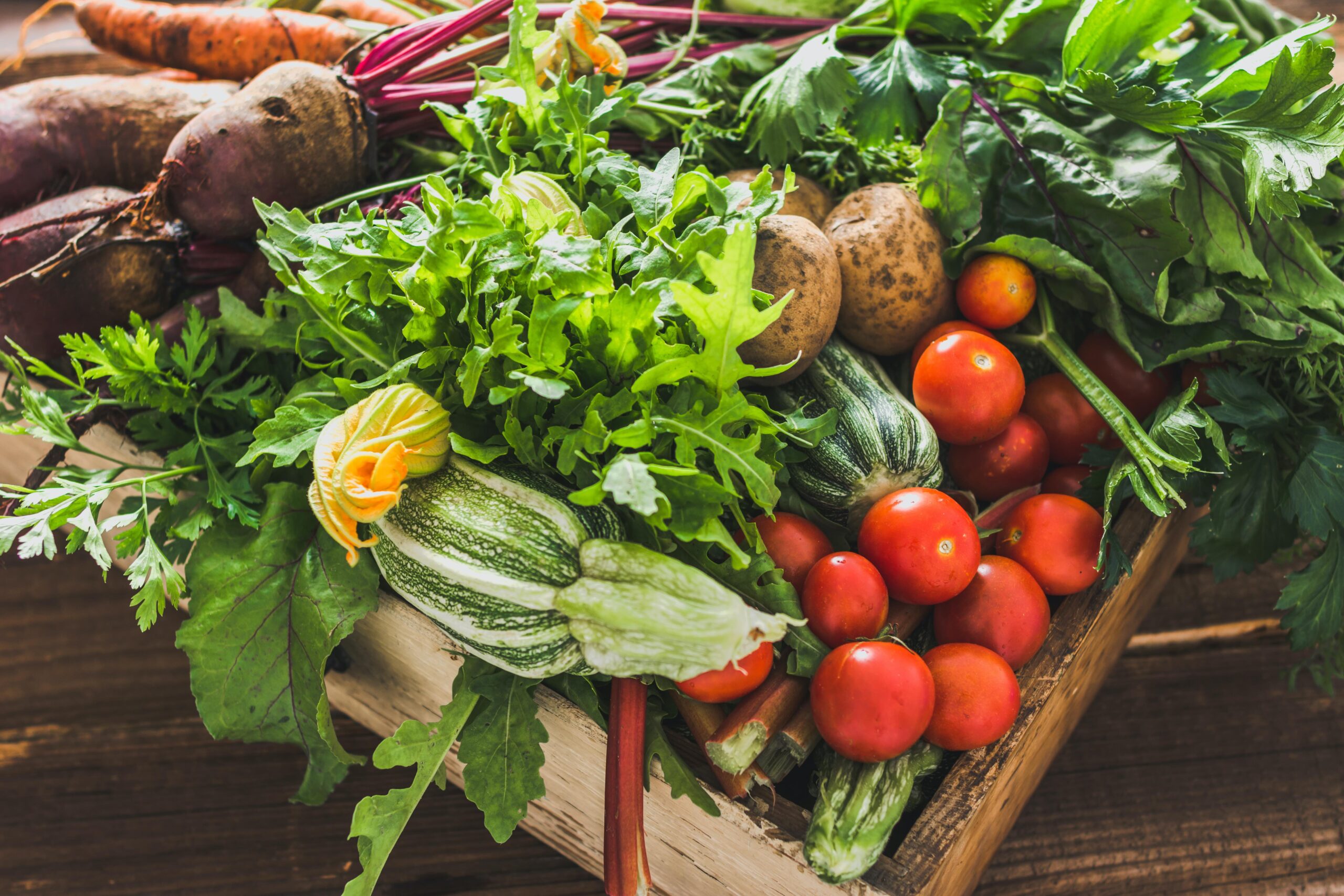 Assortment of fresh organic vegetables and garden produce on farmer market, healthy diet with vegetarian ingredients