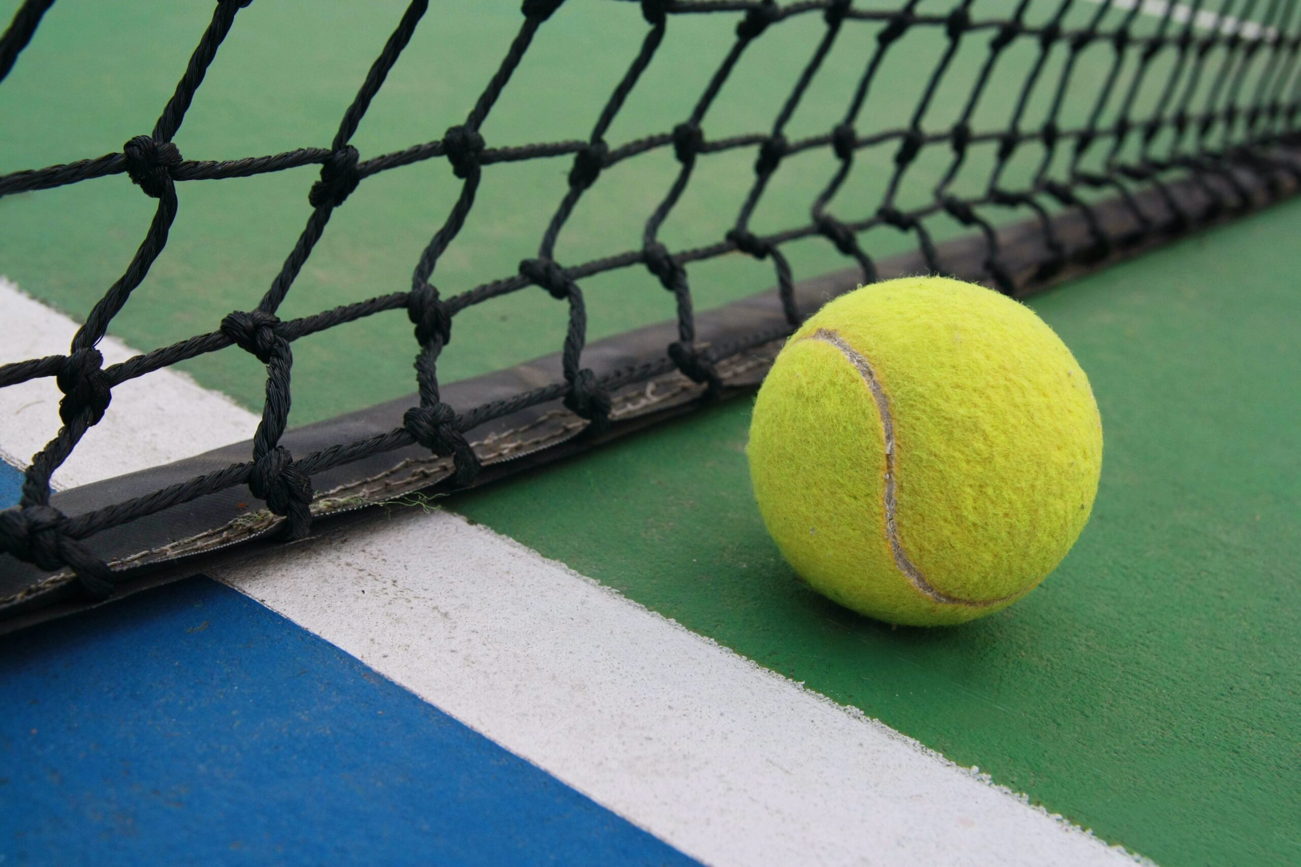 tennis on court with net