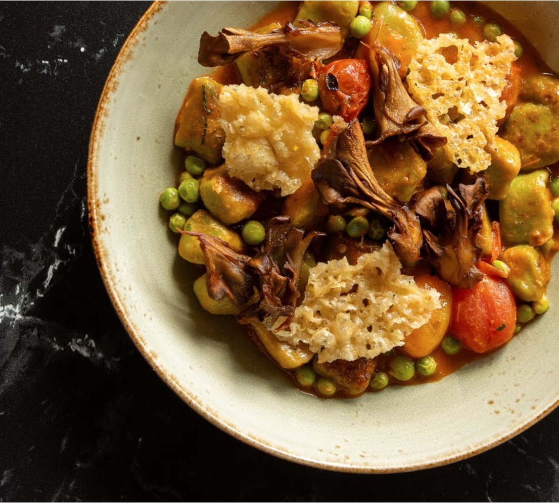 Vegetable soup in a bowl on black table 